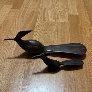 Roadrunners carved out of iron wood